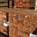 Brown 1.2m timber garden sleepers in storage at Wade Building Supplies 